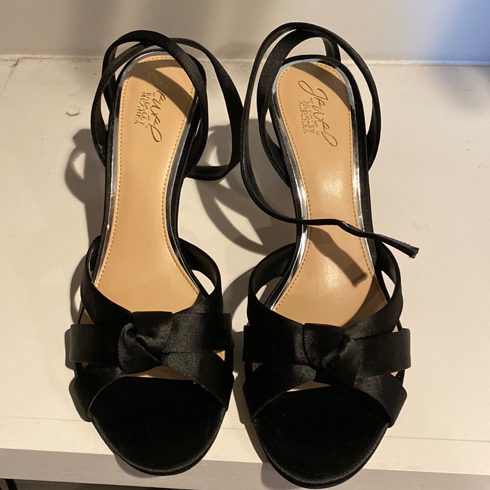 Black satin sandal heels.